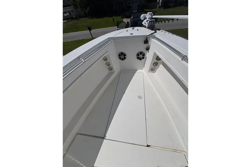 Slide: The Image of 2003 Contender 23 Open boat interior with speakers and clean deck. - 13