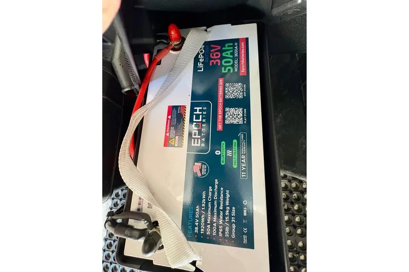 Slide: The Image of Battery in a 2003 Contender 23 Open boat, featuring 36V 50Ah capacity. - 11