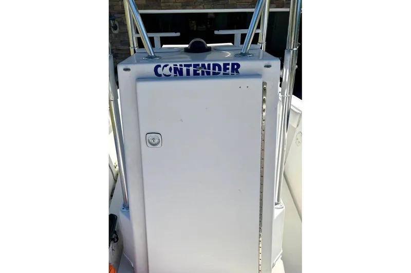 Slide: The Image of 2003 Contender 23 Open boat console with visible branding and stainless steel supports. - 8