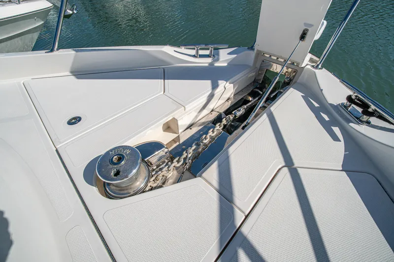 Slide: The Image of Anchor chain and winch on 2015 Riviera 6000 Sport Yacht deck. - 64