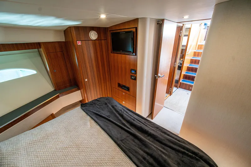 Slide: The Image of Luxurious interior of 2015 Riviera 6000 Sport Yacht with wood paneling and modern amenities. - 60