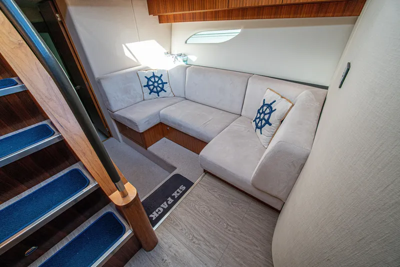 Slide: The Image of Luxurious interior of 2015 Riviera 6000 Sport Yacht with plush seating and nautical decor. - 39
