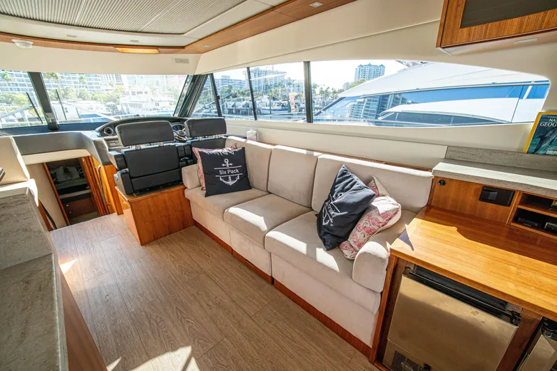 Slide: The Image of Luxurious interior of 2015 Riviera 6000 Sport Yacht with plush seating and modern design. - 30
