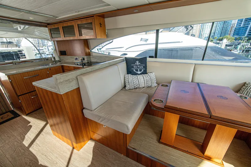 Slide: The Image of Luxurious interior of 2015 Riviera 6000 Sport Yacht with modern kitchen and seating area. - 32