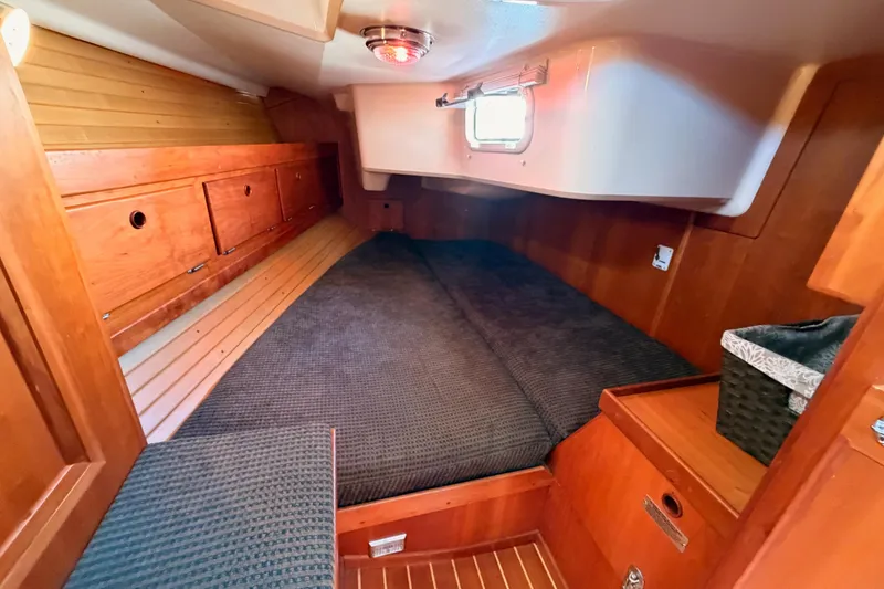Slide: The Image of Cozy cabin interior of 2002 Sabre 362 sailboat with wooden finish and comfortable bedding. - 53