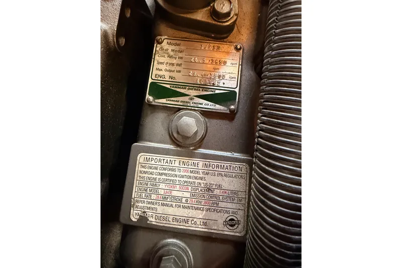 Slide: The Image of Close-up of Yanmar diesel engine labels on a 2002 Sabre 362. - 89