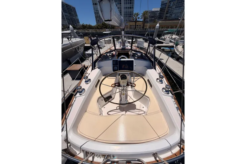 Slide: The Image of 2002 Sabre 362 sailboat cockpit with steering wheel, docked in marina. - 32
