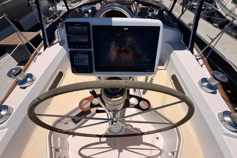 Slide: The Image of Cockpit of 2002 Sabre 362 sailboat with navigation equipment and steering wheel. - 33