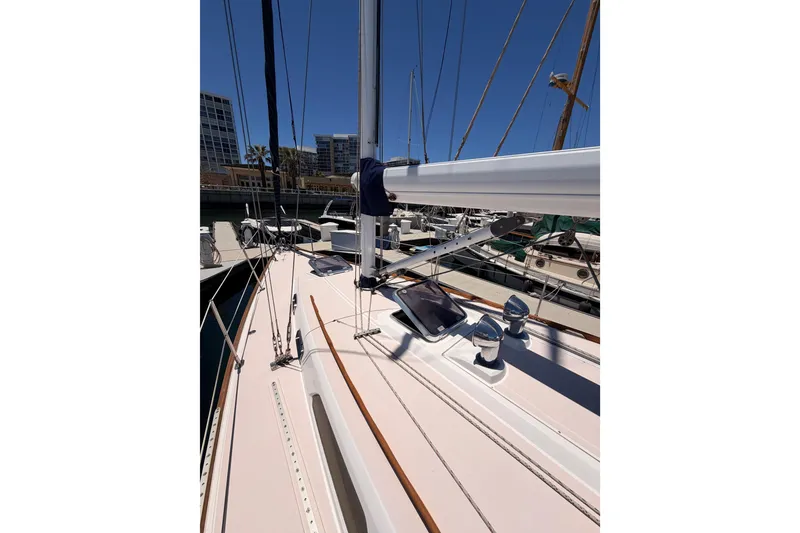 Slide: The Image of 2002 Sabre 362 sailboat deck view in marina, showcasing mast and rigging. - 15