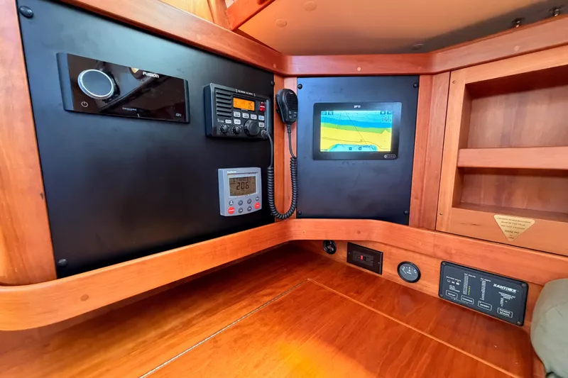 Slide: The Image of Navigation and communication panel inside a 2002 Sabre 362 sailboat cabin. - 68