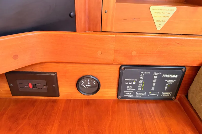 Slide: The Image of Control panel of a 2002 Sabre 362 boat with fuel gauge and electrical outlets. - 72