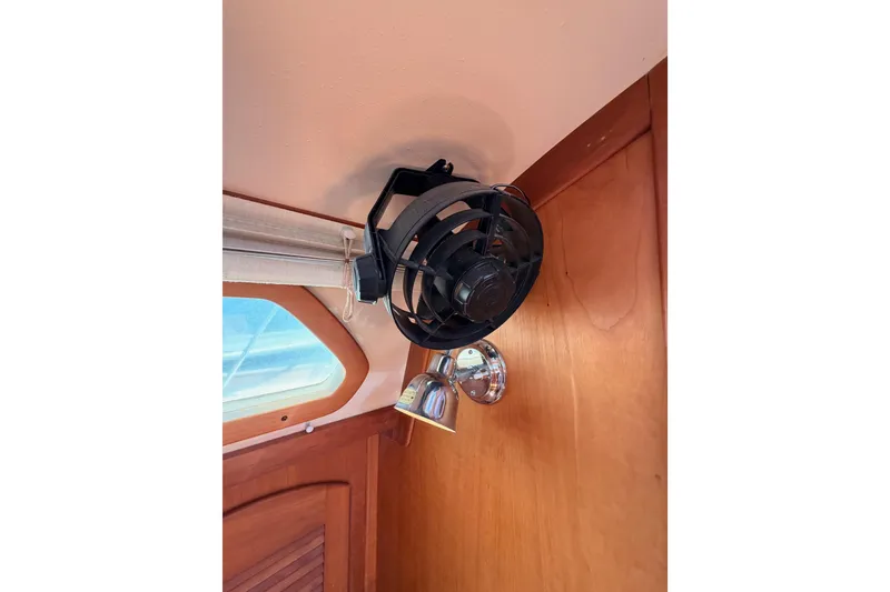 Slide: The Image of Ceiling fan and light fixture inside 2002 Sabre 362 boat cabin. - 50