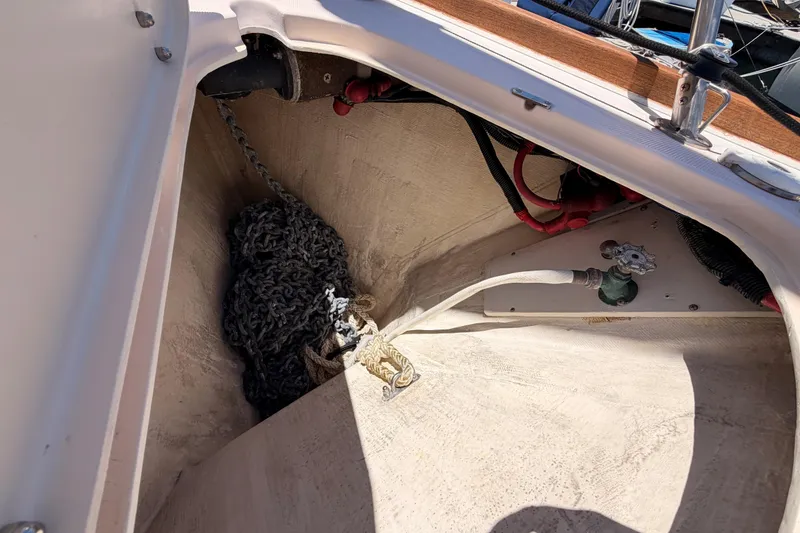 Slide: The Image of Anchor locker of a 2002 Sabre 362 sailboat with chain and hose. - 19