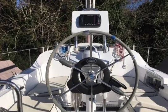 Slide: The Image of Steering wheel of a 2005 Hunter 27 sailboat with navigation equipment. - 16