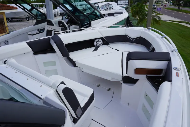 Slide: The Image of Luxurious seating area on a 2027 Monterey Elite 30 OB boat, showcasing modern design. - 16