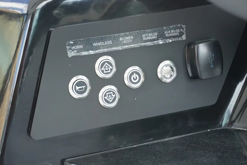 Slide: The Image of Control panel of 2027 Monterey Elite 30 OB boat with labeled buttons and USB port. - 15