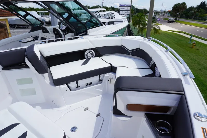 Slide: The Image of 2027 Monterey Elite 30 OB boat with luxurious seating and modern design. - 17