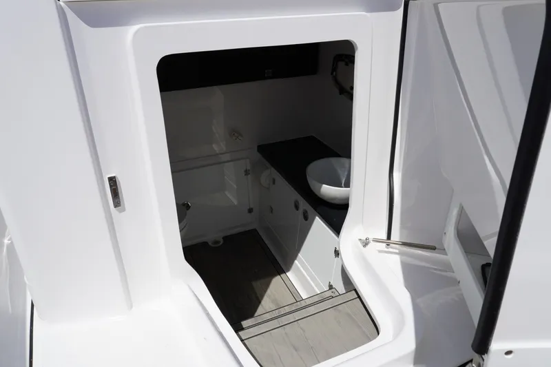 Slide: The Image of Interior view of 2027 Monterey Elite 30 OB boat bathroom with modern fixtures. - 21