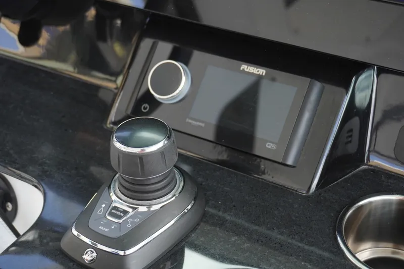 Slide: The Image of Control panel of 2027 Monterey Elite 30 OB boat with joystick and touchscreen display. - 14