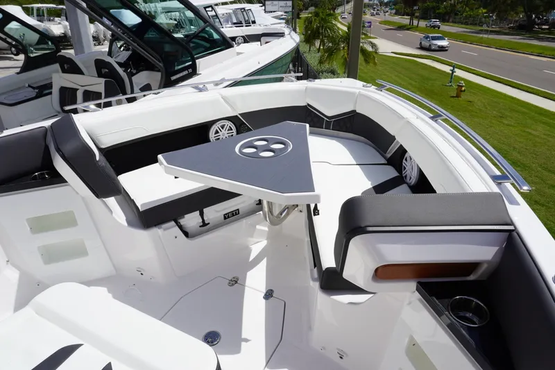 Slide: The Image of Luxurious seating area on a 2027 Monterey Elite 30 OB boat, featuring a sleek design. - 19