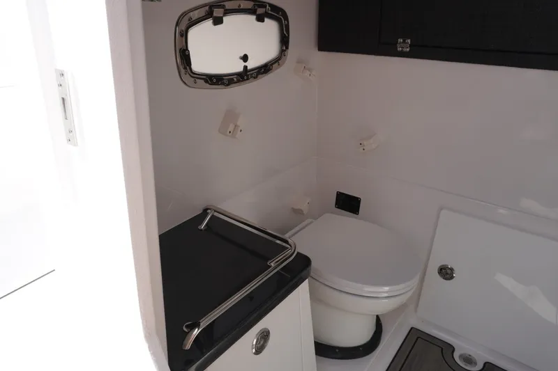 Slide: The Image of Bathroom interior of 2027 Monterey Elite 30 OB boat, featuring modern fixtures and compact design. - 22
