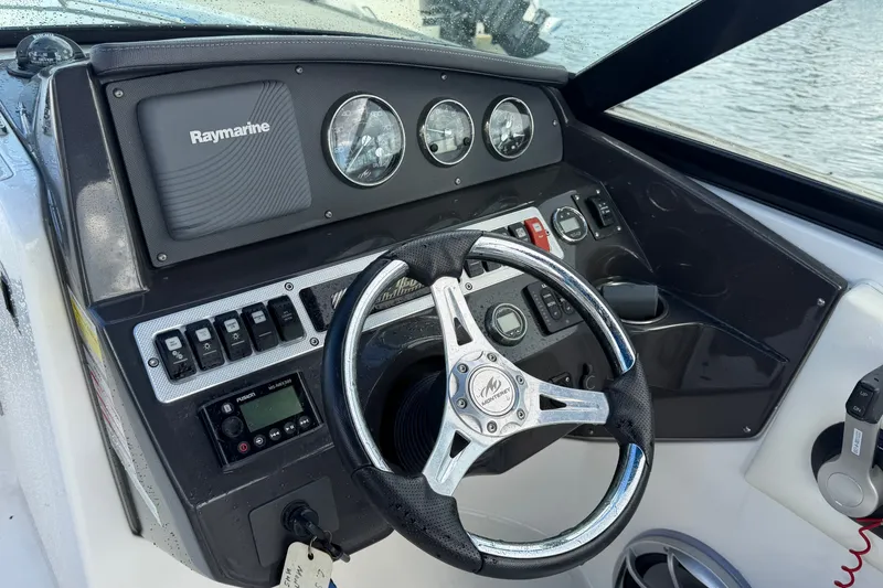 Slide: The Image of Steering console of a 2017 Monterey M-45 boat with Raymarine electronics. - 17