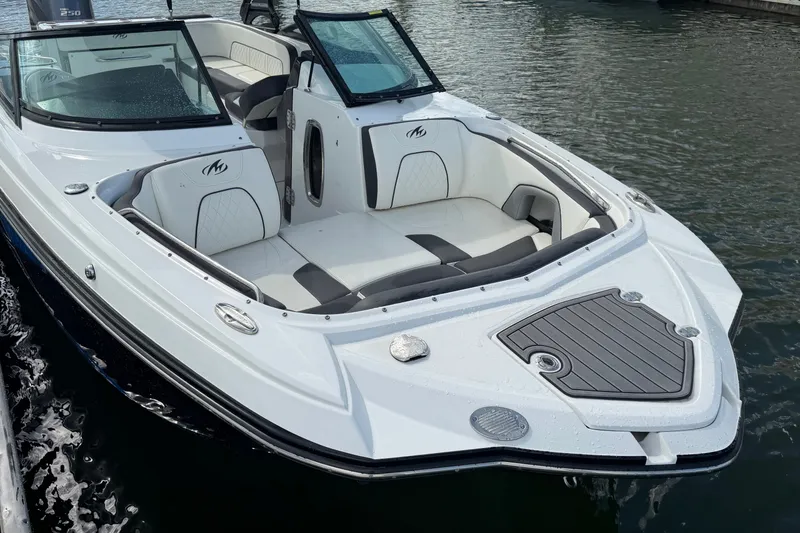 Slide: The Image of 2017 Monterey M-45 boat with sleek white design and spacious seating on the water. - 15