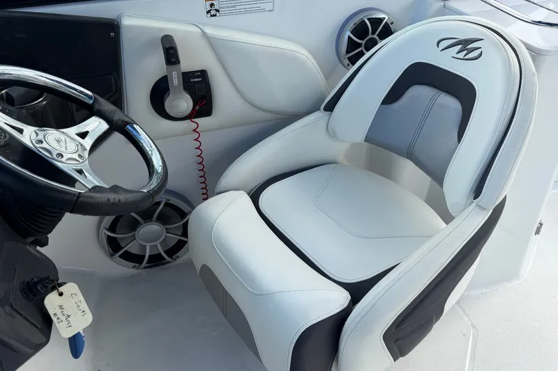 Slide: The Image of Captain's seat and steering wheel of a 2017 Monterey M-45 boat interior. - 20