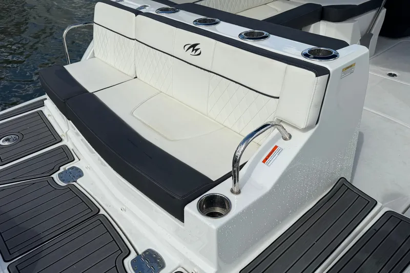 Slide: The Image of Luxury seating on a 2017 Monterey M-45 boat with cup holders and elegant design. - 11