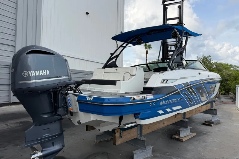Slide: The Image of 2017 Monterey M-45 boat with Yamaha outboard motor, docked outdoors. - 4