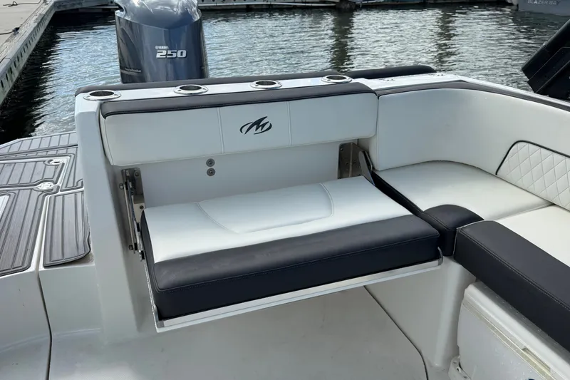 Slide: The Image of 2017 Monterey M-45 boat interior with Yamaha 250 engine, featuring sleek seating and cup holders. - 13