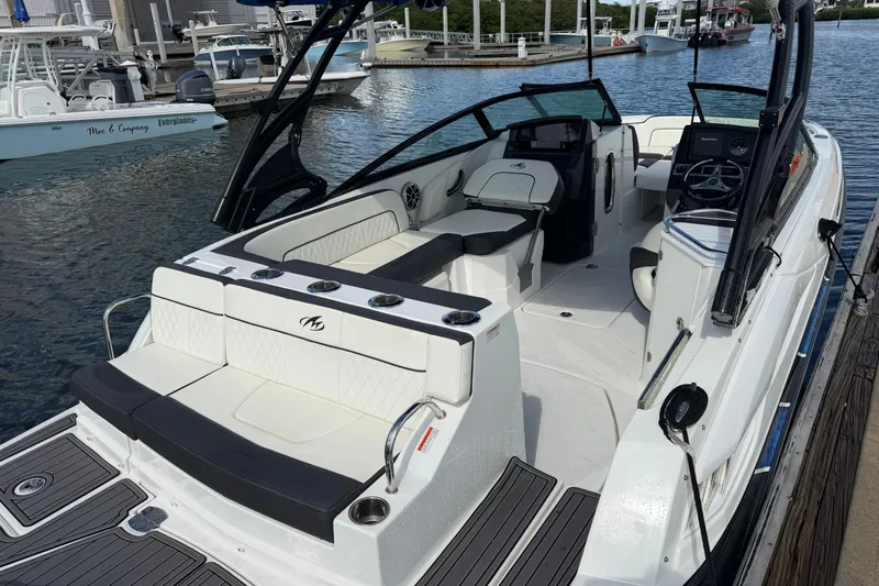 Slide: The Image of 2017 Monterey M-45 boat docked, featuring spacious seating and modern design. - 8