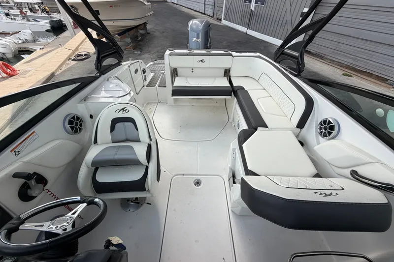 Slide: The Image of 2017 Monterey M-45 boat interior with white seating and steering wheel. - 21