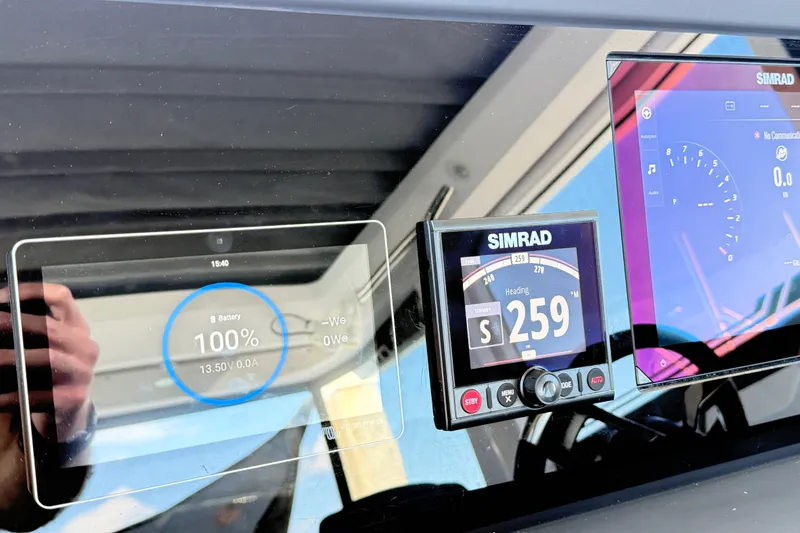 Slide: The Image of Dashboard of 2024 Axopar 29 XC Cross Cabin with Simrad navigation displays. - 19