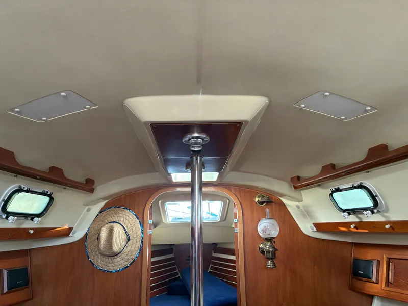 Slide: The Image of Interior of a 1988 Pearson 33-2 with wood finish and portholes. - 24