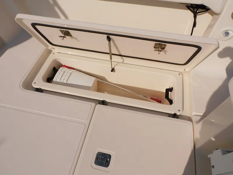 Slide: The Image of An open storage compartment on a 2013 Tiara Yachts 3600 Open with a paddle inside. - 43