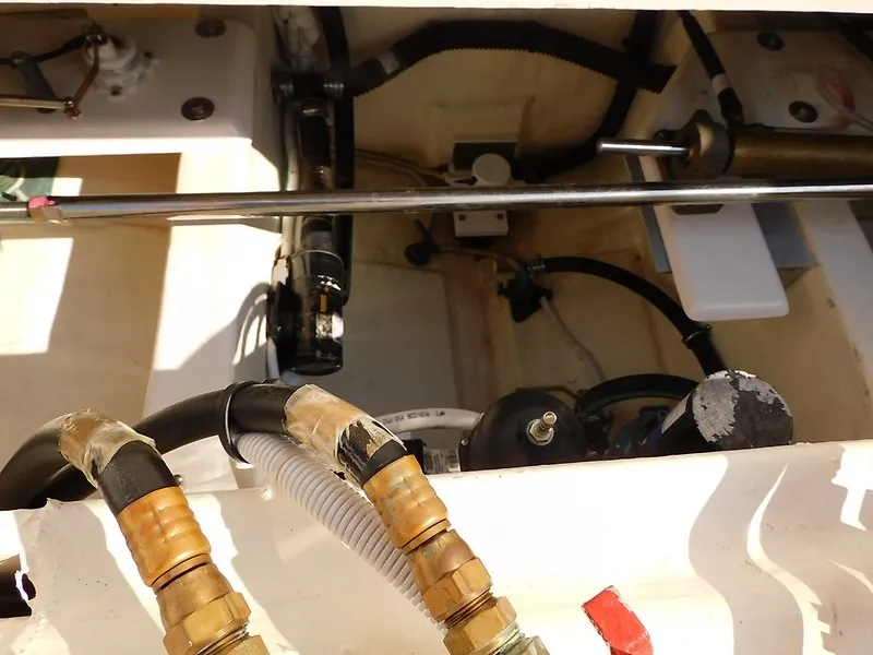 Slide: The Image of Close-up of the engine compartment in a 2013 Tiara Yachts 3600 Open, showing hoses and cables. - 39