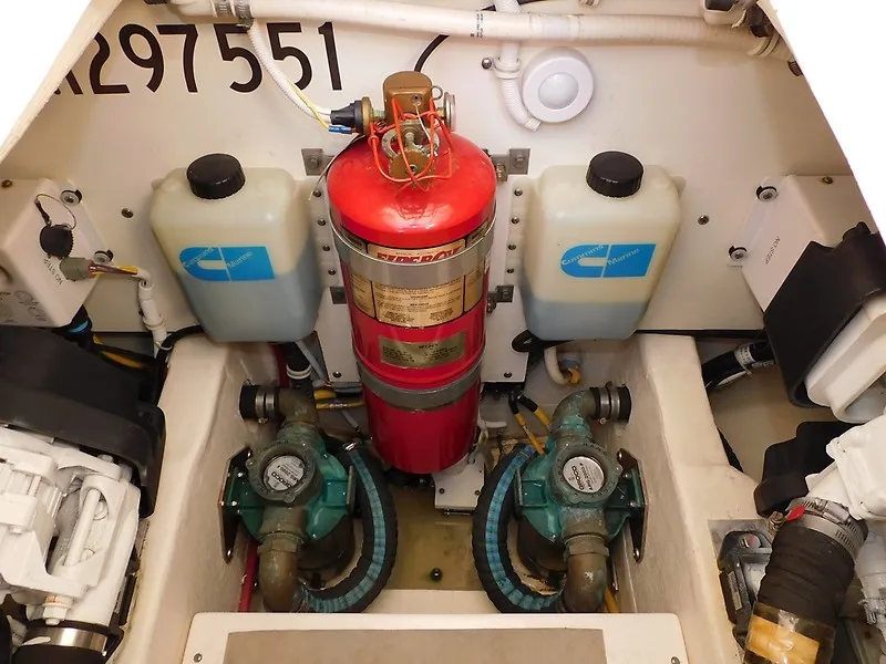Slide: The Image of The engine room of a 2013 Tiara Yachts 3600 Open features a fire extinguisher and pumps. - 44