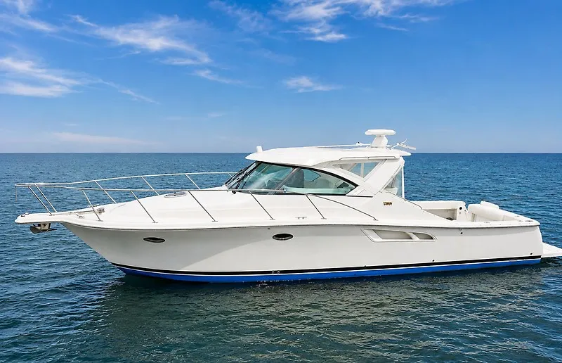 Slide: The Image of The 2013 Tiara Yachts 3600 Open is a sleek white boat on calm waters. - 1