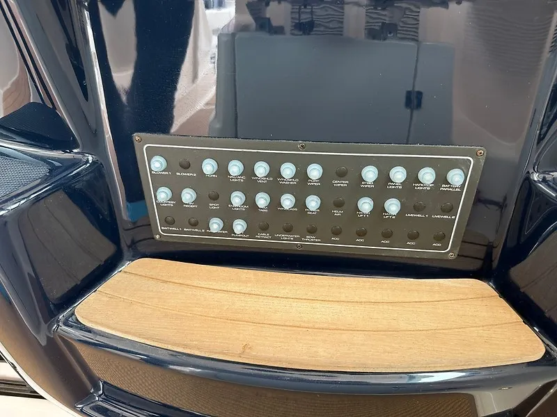 Slide: The Image of A control panel with numerous switches on a 2013 Tiara Yachts 3600 Open. - 18
