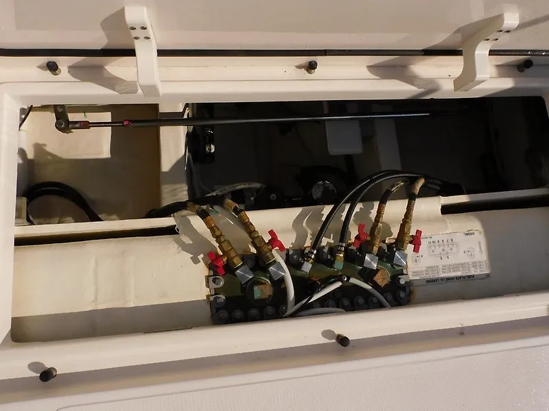 Slide: The Image of An open compartment with multiple valves and hoses inside a 2013 Tiara Yachts 3600 Open. - 40