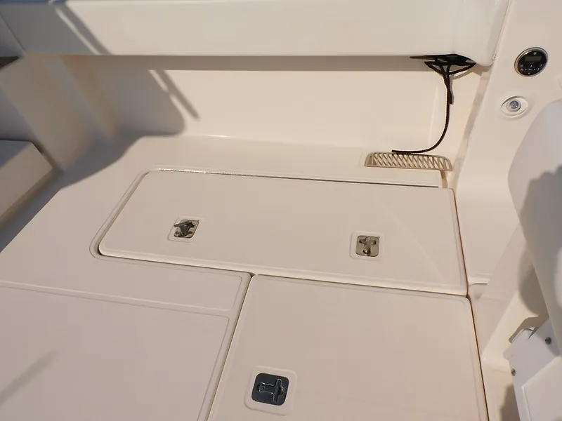 Slide: The Image of The image shows the deck of a 2013 Tiara Yachts 3600 Open with storage hatches. - 42
