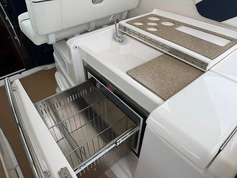 Slide: The Image of The 2013 Tiara Yachts 3600 Open features a modern galley with stainless steel fridge and sink. - 20