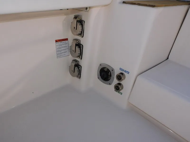 Slide: The Image of Close-up of connections and switches on a boat, including fresh water and waste outlets. - 48