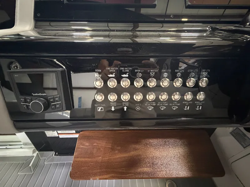 Slide: The Image of Dashboard of the Cruisers Yachts 38 GLS with switches and controls. - 19