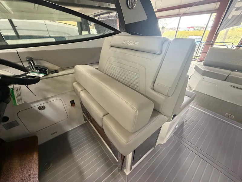 Slide: The Image of Interior of a 2027 Cruisers Yachts 38 GLS with sleek, light-colored upholstered seating. - 27