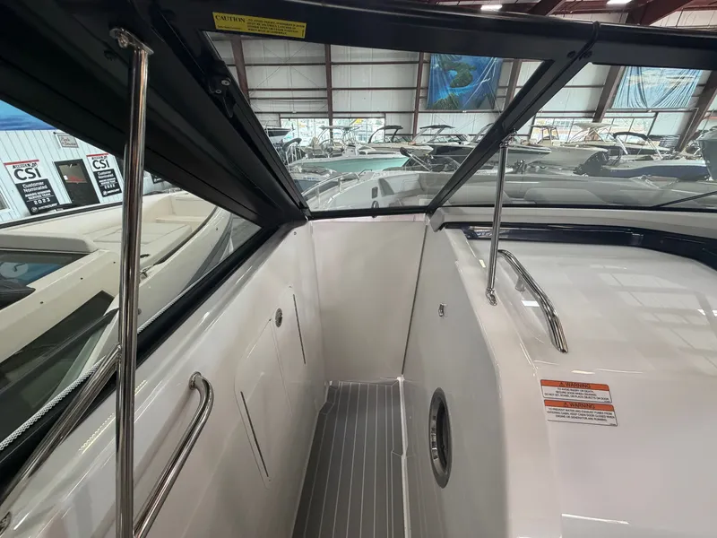 Slide: The Image of The image shows the cockpit of a 2027 Cruisers Yachts 38 GLS with sleek stainless steel railings. - 17