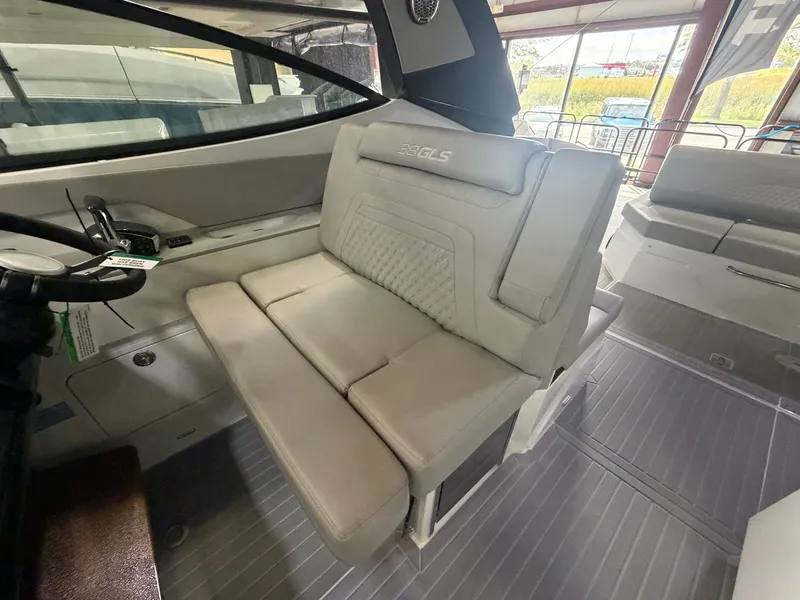 Slide: The Image of Interior of the Cruisers Yachts 38 GLS with beige upholstered seating and modern design. - 38