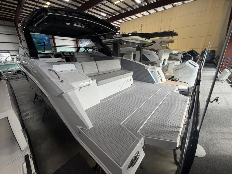Slide: The Image of The 2027 Cruisers Yachts 38 GLS features a sleek design with a spacious deck and comfortable seating areas. - 14