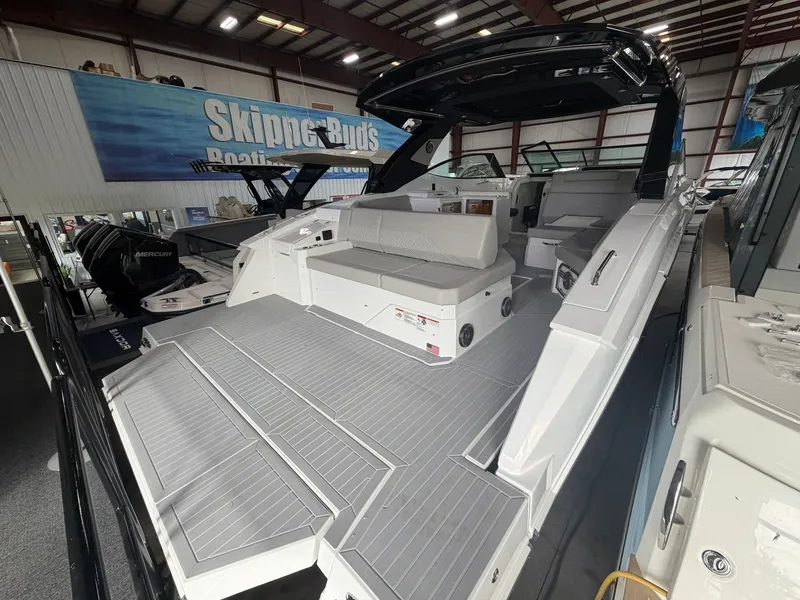 Slide: The Image of The 2027 Cruisers Yachts 38 GLS features a modern design with gray upholstery and a spacious deck. - 34